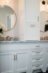 a beautiful bathroom with custom cabinetry