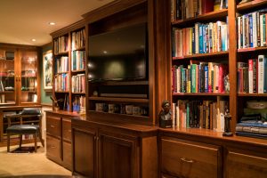 a home office with built-in bookshelves