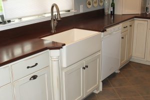 farm sink in antique white cabinetry